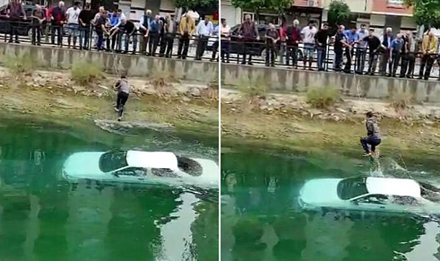 Otomobil kanala uçtu; araç üzerine çıkan sürücü zor anlar yaşadı