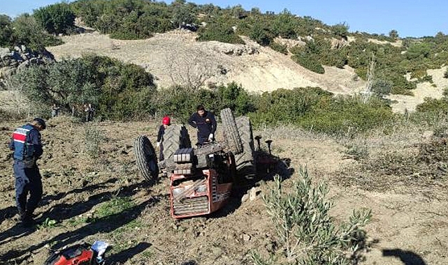 Kullandığı traktörün altında can verdi