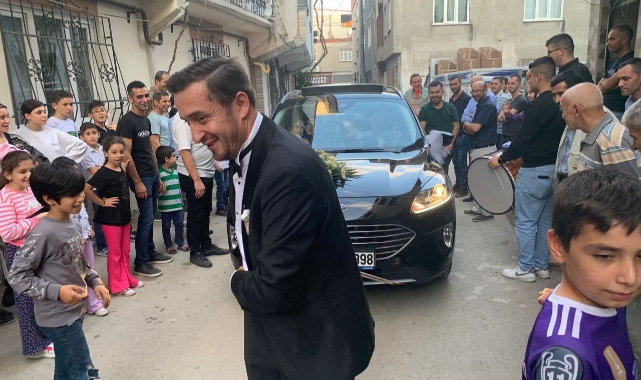 Bursa'da ilginç düğün eğlencesi! Damat halatla araba çekti
