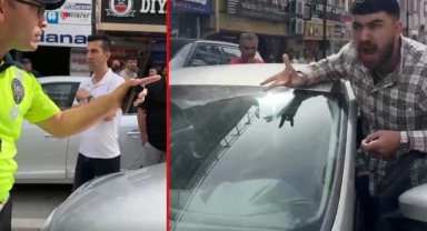 Kendisini uyaran polisin üzerine otomobilini sürdü