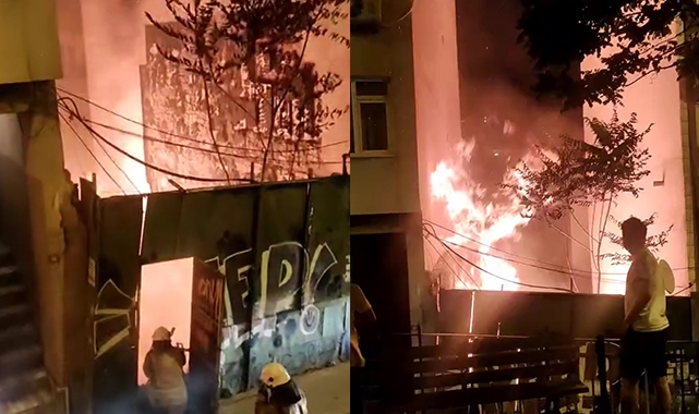 Bina yanarken mahalleli birbirine girdi