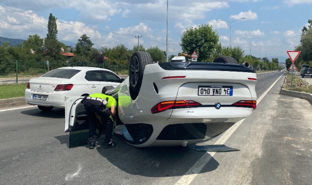 Takla atan otomobilden burnu bile kanamadan kurtuldu