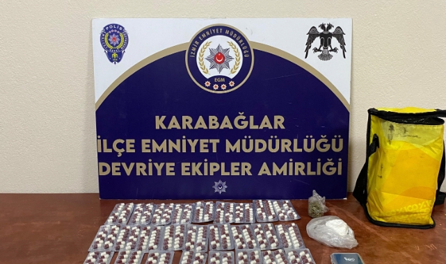 İzmir'de uyuşturucuyu çöpe atan genç, polislere yakalandı
