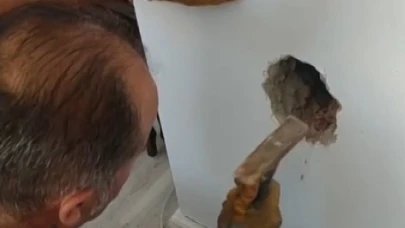 Bacada mahsur kalan kediyi itfaiye ekipleri kurtardı