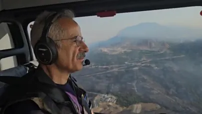Bakan Uraloğlu, helikopterle yangın bölgesinde