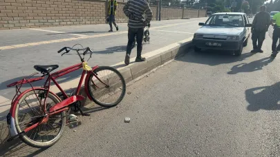 Otomobil bisikletle çarpıştı