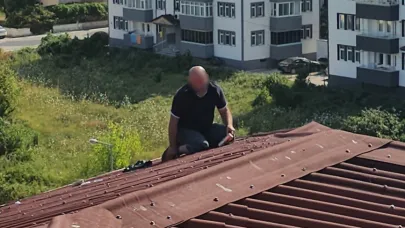 Alkollü şahıs 3 saatlik çabayla çatıdan indirildi