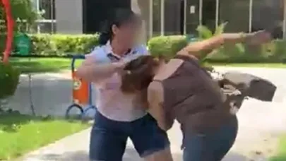 Kocasıyla parkta bastığı kadını saçından sürükledi
